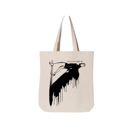 Canvas tote bag featuring a black and white graphic design of a reclining figure with dripping effect and ’HALESTORM’ text.