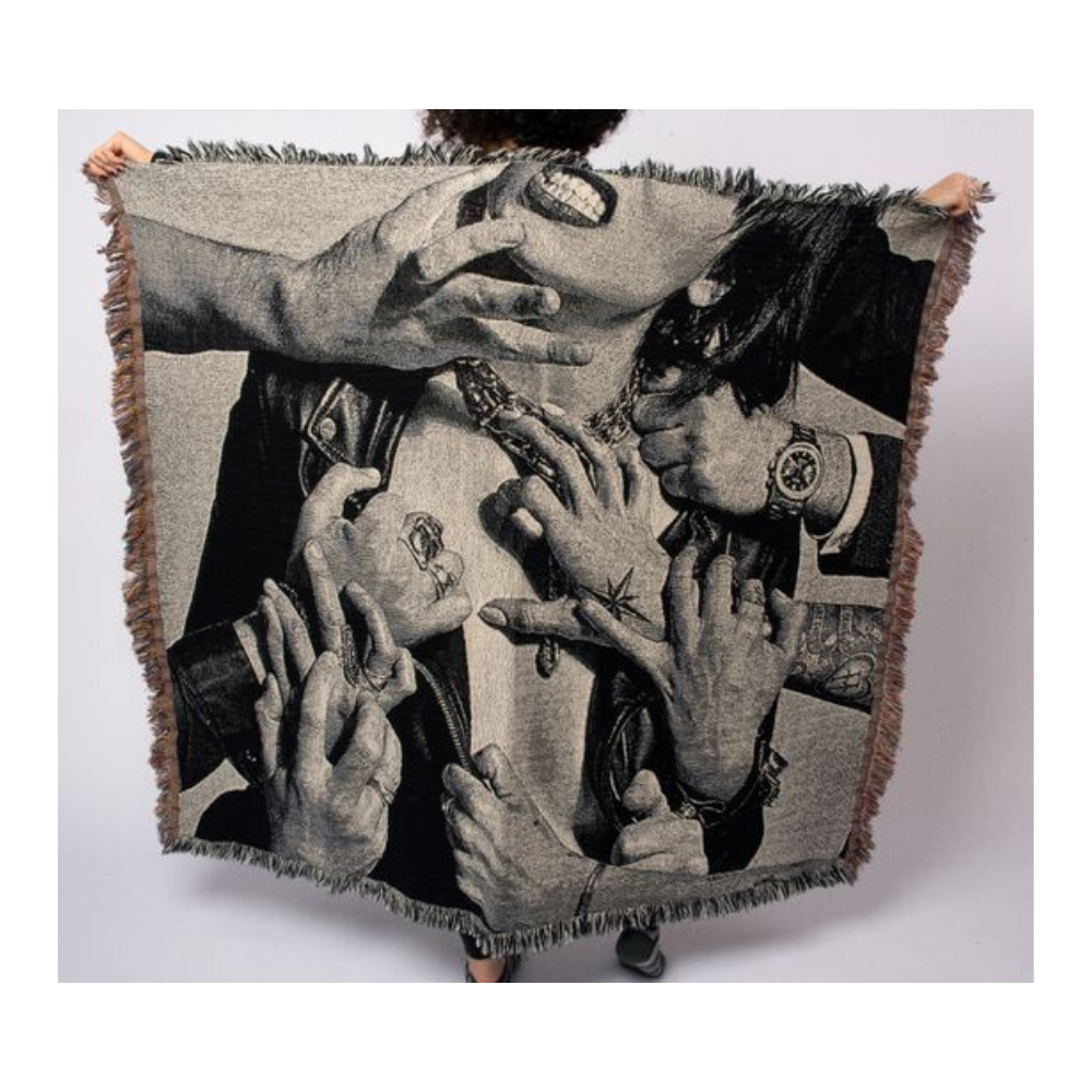 Woven blanket or tapestry featuring a black and white photographic image of tattooed hands and arms.